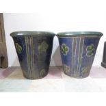 A pair of large blue garden pots