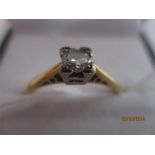 An 18ct gold diamond solitaire in square shaped setting