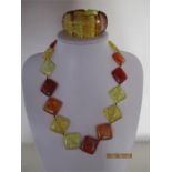 A Baltic amber necklace and matching bracelet