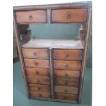 A small hanging set of 14 drawers