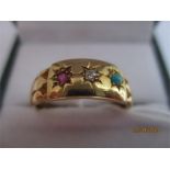 A Victorian gypsy set 18ct gold ring set with a turquoise, ruby and diamond