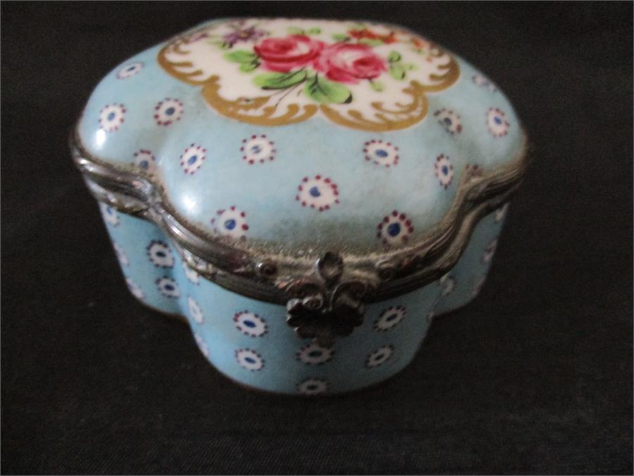 A small handpainted porcelain pot with hinged lid, Sevres style markings to base for 1754/5