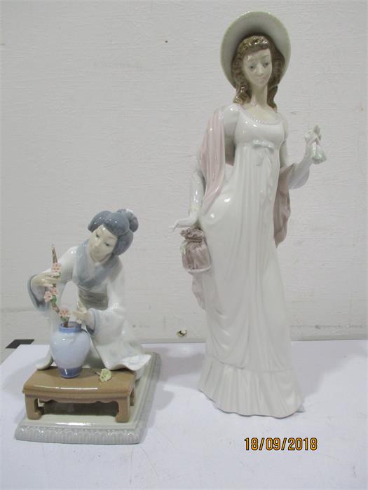 Two Lladro figures, a kneeling Geisha girl and a young girl standing- both have 1 finger broken