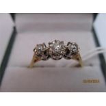 A diamond three stone ring set in 18ct gold