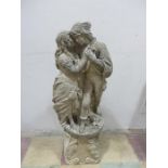 A concrete statue in the form of lovers on mismatched plinth