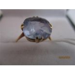 A solitaire ring set with a pale blue square cushion cut stone ( thought to be a pale sapphire)