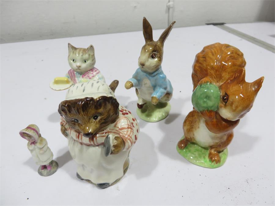 Four Beatrix Potters figures including Peter Rabbit, Squirrel Nutkin, Ribby and Mrs Tiggy Winkle