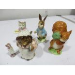 Four Beatrix Potters figures including Peter Rabbit, Squirrel Nutkin, Ribby and Mrs Tiggy Winkle
