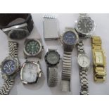 A collection of various gents wristwatches and a lighter