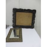 A Chinese hardwood carved frame with pierced decoration, along with a brass mirror with shell