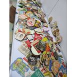 A large collection of vintage beer mats
