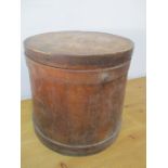 A vintage wooden container and lid