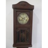 An oak Westminster chime wall clock