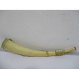 A 19th century African ivory Oliphant or war horn with oval mouthpiece, 55cm length