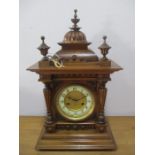 An early 20th century mantle clock with architectural case, crossed arrow mark to dial and chiming