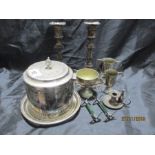 A collection of silver plated items including candlesticks, biscuit barrel,chamber stick, sauce