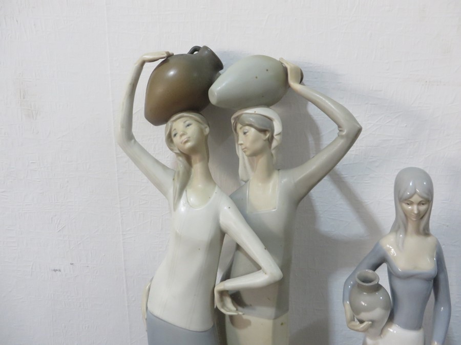 A large Lladro figure of two women holding pots on their head A/F, two other Lladro style figures, - Image 3 of 14