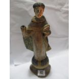 A 19th century wooden figure of a monk - 34cm Height
