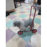 A vintage pull along toy dog