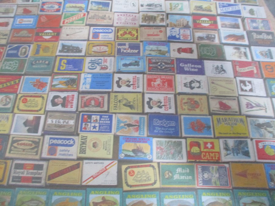 A large collection of vintage match boxes