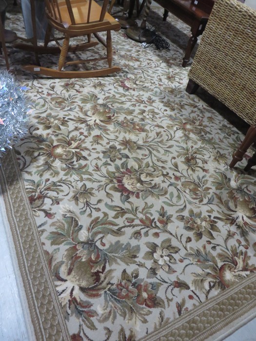 A large beige round rug