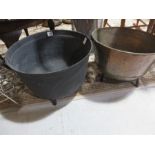 A cast iron cauldron along with a copper on stand, diameter of cast iron 44cm