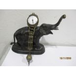 A German elephant mystery clock, c.1900. The standing patinated spelter figure of an elephant with