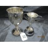 Two hallmarked silver cups the larger inscribed "Army Cup 1936-7, presented by the officers of the