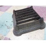 A cast iron boot scraper