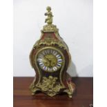 A French boulle clock with ormolu cherub finial and mounts, movement signed Woppenheim, Paris