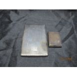 A small hallmarked silver card case along with a silver plated Han Bro cigarette case