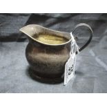 A hallmarked silver cream jug, weight 80.3g