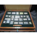 A wooden cased set of 25 Sterling silver ingots "The stamps of Royalty" commemorating the Silver