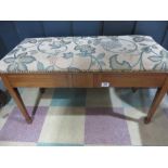 A duet stool with tapestry seat