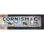 A vintage enamelled sign "Cornish & Co. The Outfitters, Corner of North Street" (Exeter), approx 6
