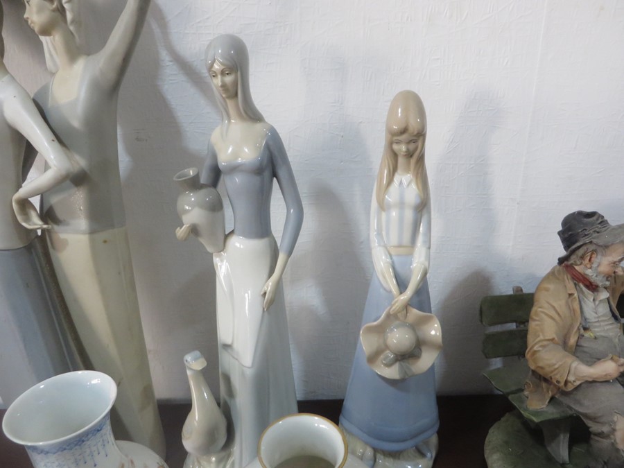 A large Lladro figure of two women holding pots on their head A/F, two other Lladro style figures, - Image 4 of 14