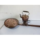 A copper spirit kettle on stand and a copper warming pan