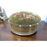 A round Victorian footstool/sewing box with tapestry cover and lift up lid