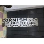 A vintage enamelled sign "Cornish & Co. The Outfitters, Corner of North Street, Exeter"