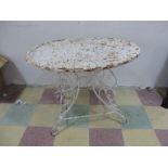 A 19th century wrought iron oval shaped garden table A/F