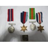 Four World War II medals, Defence medal, 1939- 1945, 1939-1945 star and the France and Germany