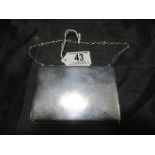 A hallmarked silver purse with aide memoir inside