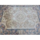 A cream ground rug 165cm x 125cm