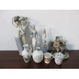 A large Lladro figure of two women holding pots on their head A/F, two other Lladro style figures,