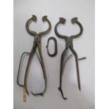 Two pair of steel sugar cutters along with a steel flint