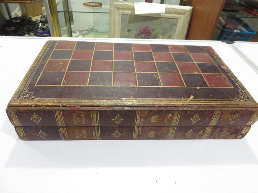 A Victorian leather games box in the form of two volumes of "History of England", consisting of