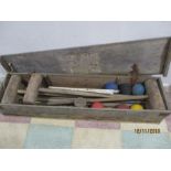 A vintage croquet set in wooden box