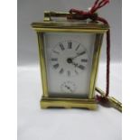 A French brass cased carriage clock with chiming mechanism ( bell missing)