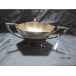 A large Walker & Hall silver hexagonal bowl with three handles, hallmarked for Sheffield 1927,