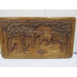 A carved panel of apple pickers, signed P. Verdeau, 80cm x 45 cm